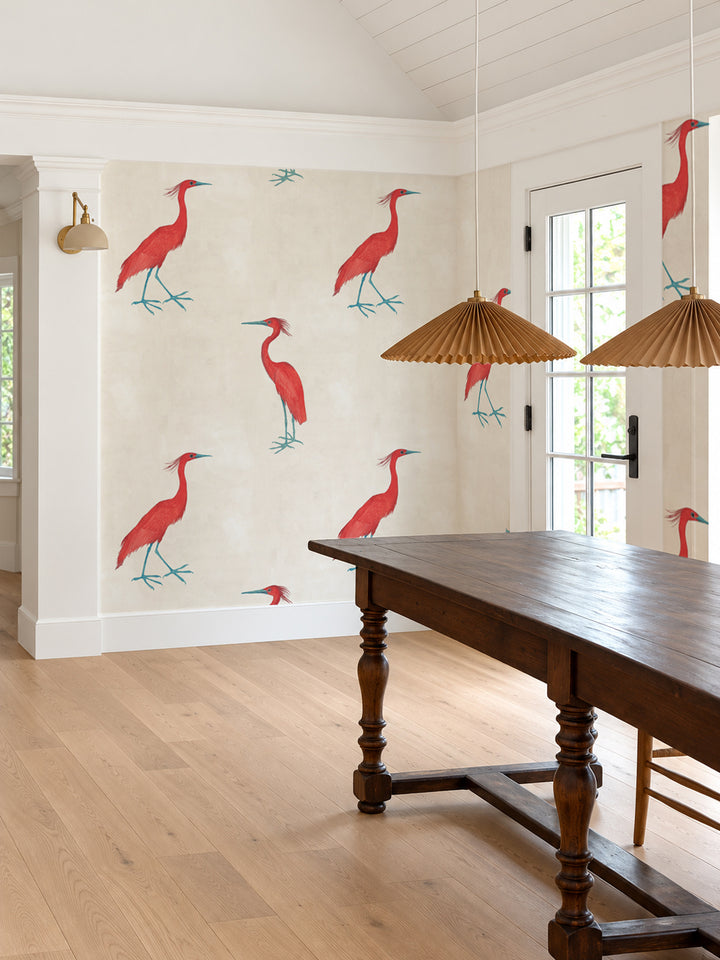 Ivory wallpaper with red egret birds and teal legs, arranged in a repeating pattern