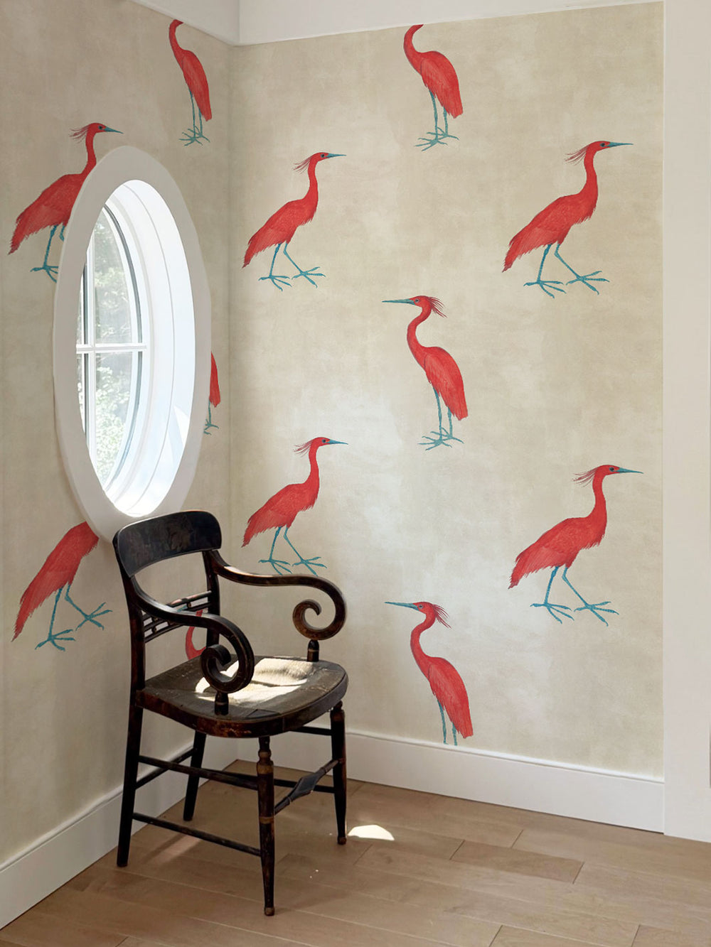 Wallpaper panel with repeating red egret birds and teal legs on light parchment