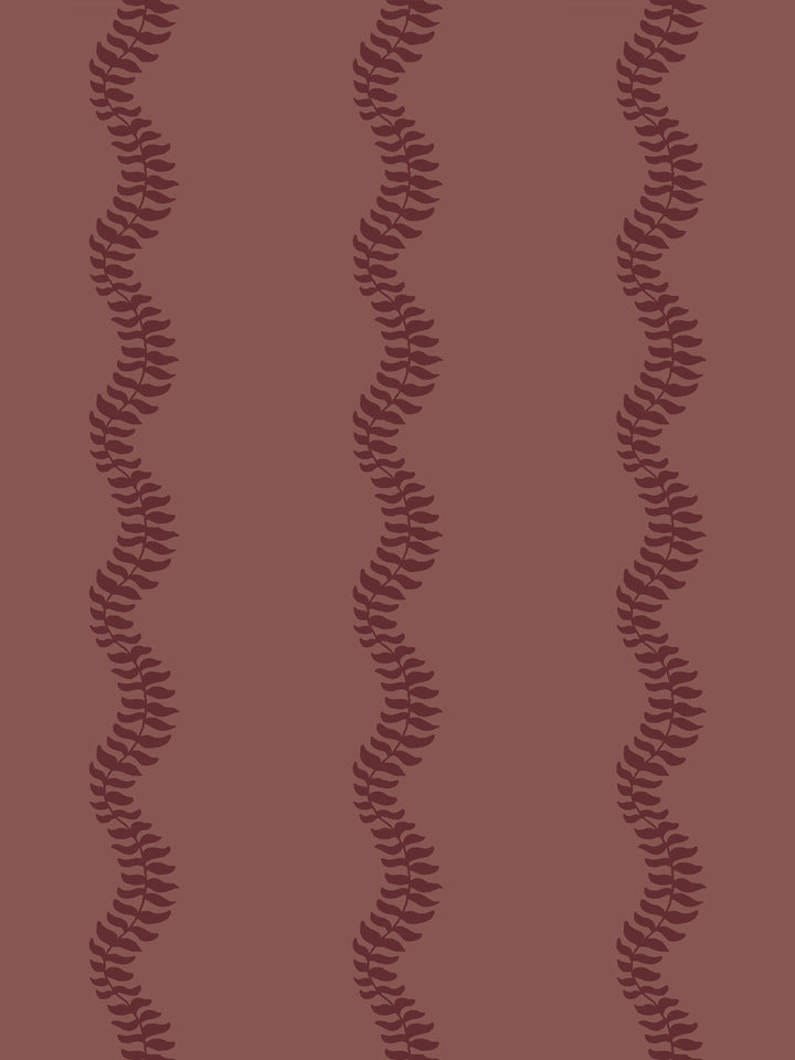 Close crop of deep wine burgundy leaf stripes on muted brick rose-brown like faded