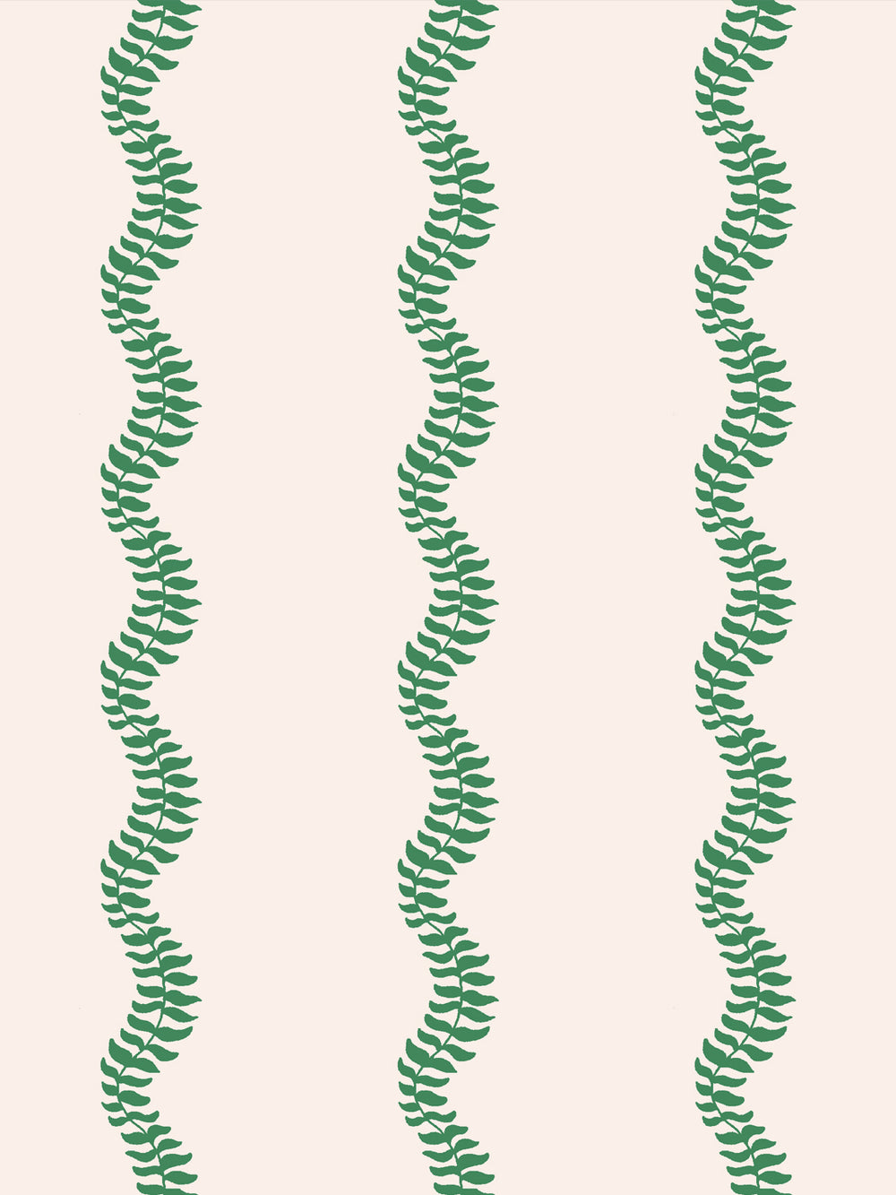 Close crop of bright kelly emerald green leaf stripes on warm cream
