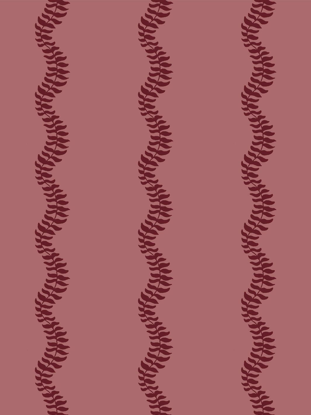 Close crop of deep garnet wine red leaf stripes on dusty rose pink