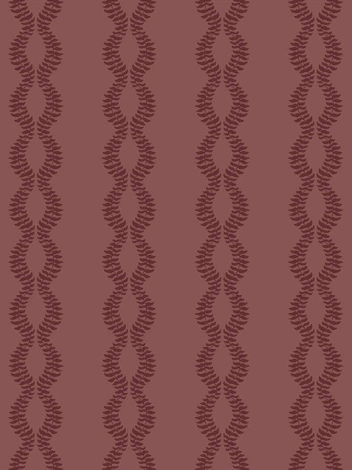 Close crop of dark maroon leaf vines on muted brick red