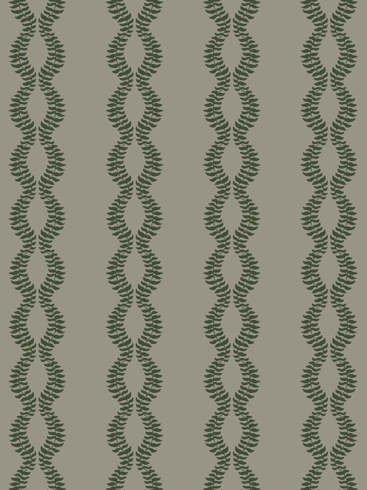 Close crop of dark pine or forest green leaf vines on warm grey-taupe greige