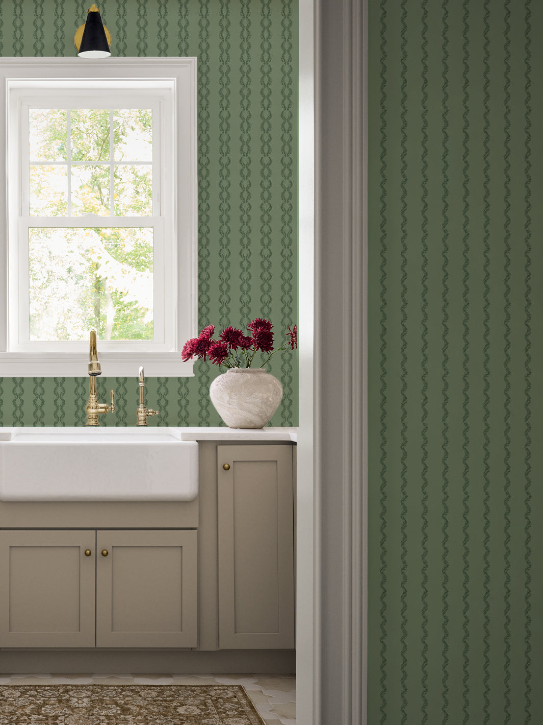 Antique Leaf Sutton Vine kitchen wall with farmhouse sink, brass faucet and taupe cabinets