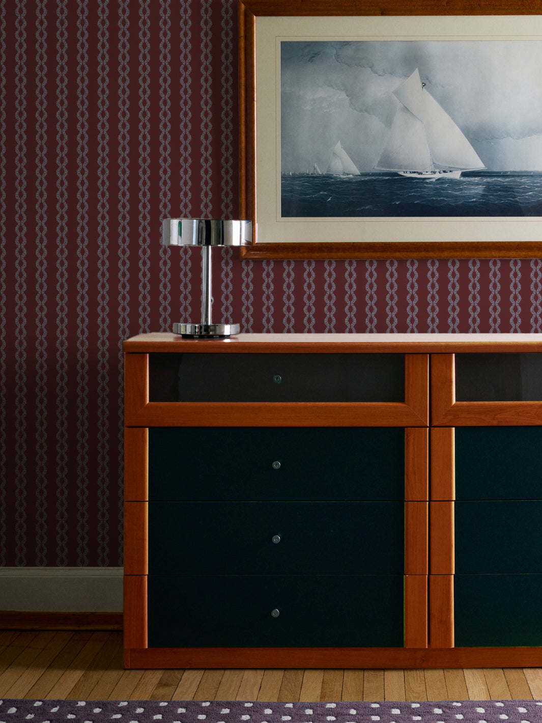 Faded Periwinkle Merlot Sutton Vine wall above a teal and wood dresser with a framed sailboat print