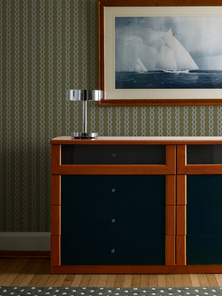 Fern Sky Sutton Vine wall above a teal and wood dresser with chrome lamp and sailing yacht print