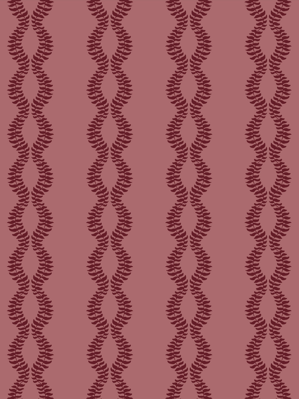 Close crop of deep garnet burgundy leaf vines on dusty rose