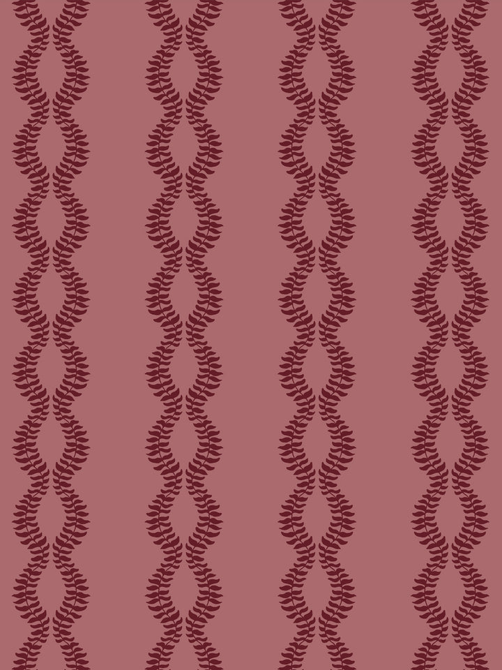 Close crop of deep garnet burgundy leaf vines on dusty rose
