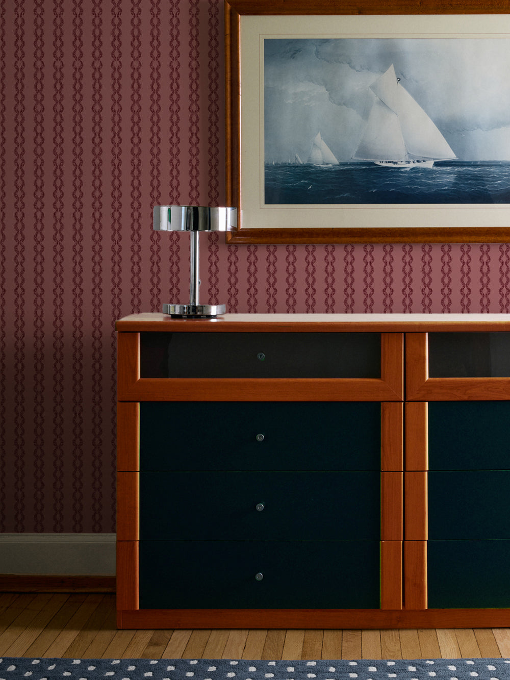 Heirloom Garnet Sutton Vine wall above a teal and wood dresser with a framed sailboat print