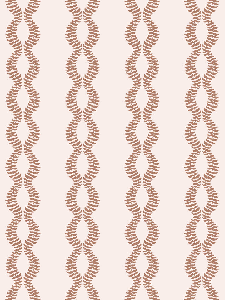 Close crop of terracotta clay leaf vines on blush-tinted cream