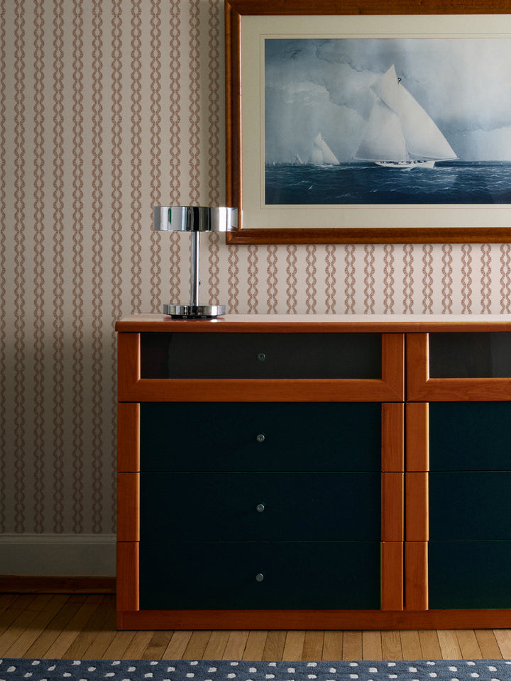 Toasted Cream Sutton Vine wall above a teal and wood dresser with chrome lamp and yacht print