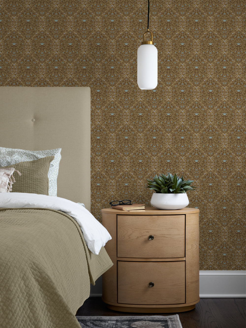 Bedroom with Aged Olive Taliah Large wallpaper, cream linen headboard, olive quilt and oak nightstand