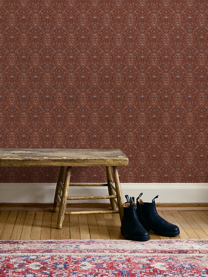 Entryway with Painted Clay Taliah Large wallpaper, wood bench, black boots and a red Persian rug