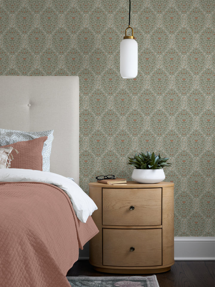Bedroom with Silver Sage Taliah Large wallpaper, cream headboard, terracotta quilt and oak nightstand