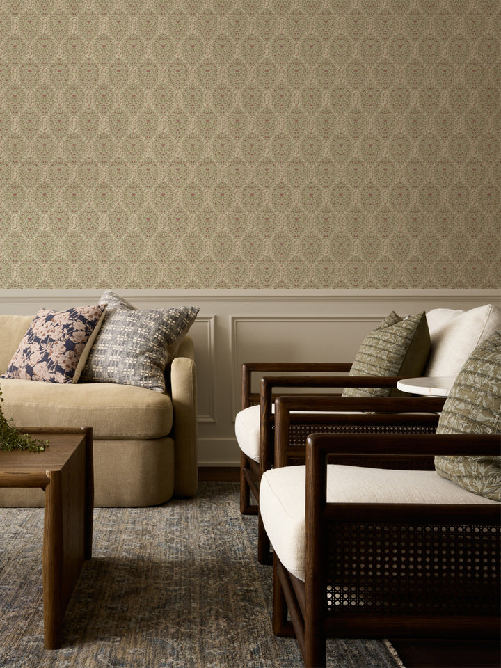 Cream and sage Taliah wallpaper above white wainscot with a beige sofa and cane armchairs
