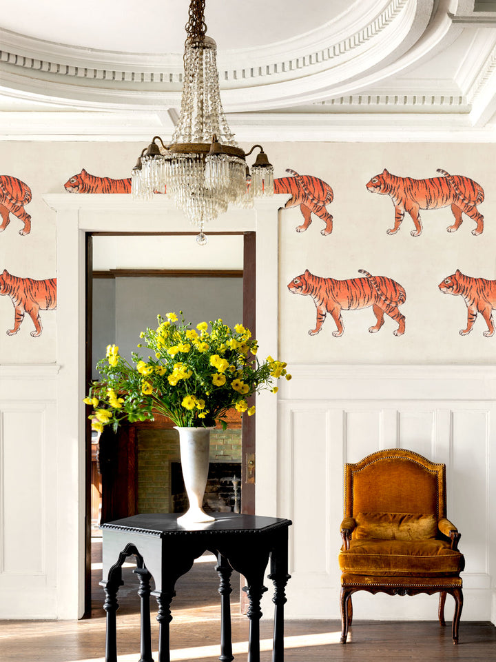 Tiger wallpaper on ivory wall with scattered illustrated tigers across the surface