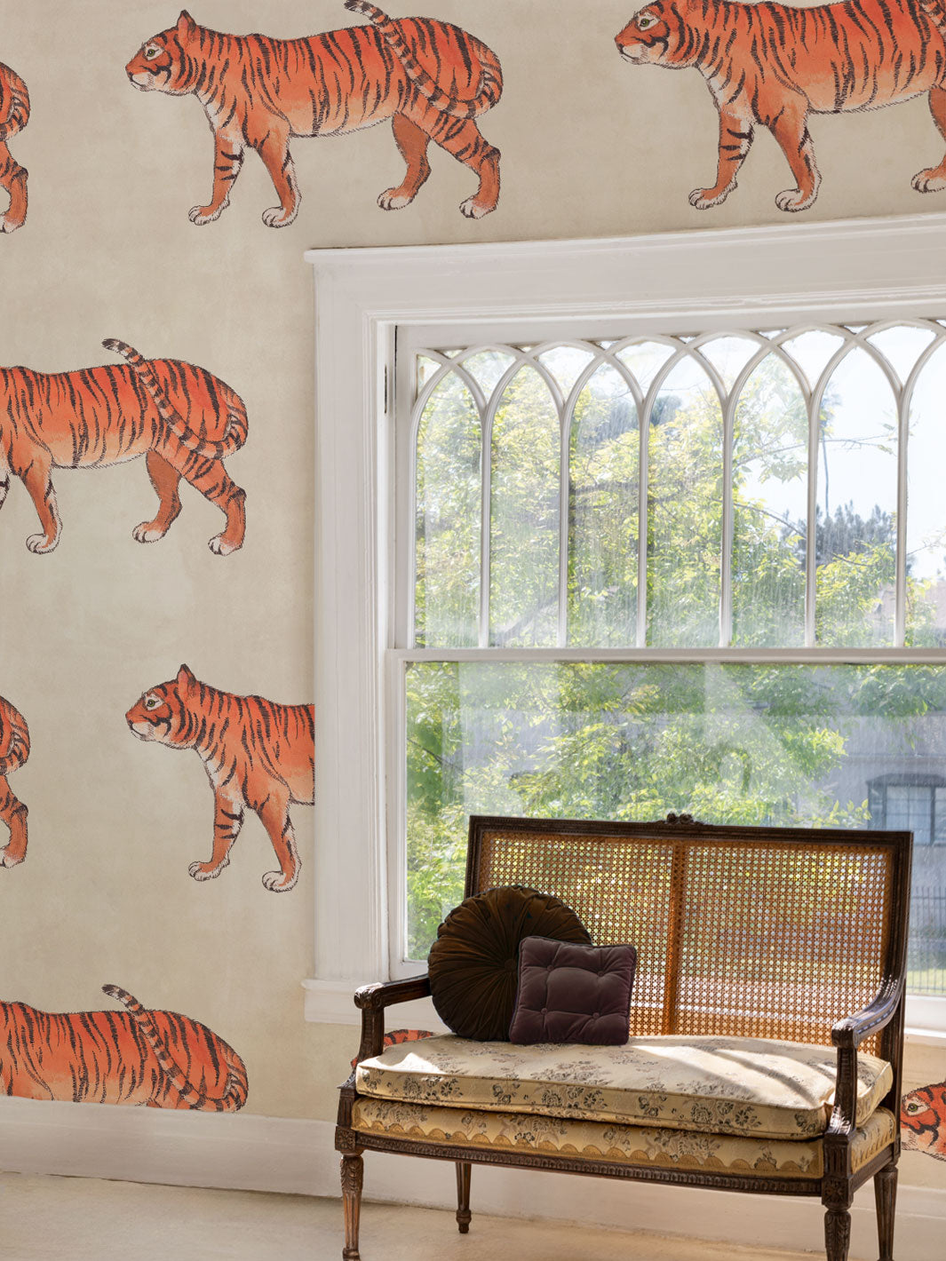 Tiger animal print wallpaper covering wall, orange striped tiger pattern