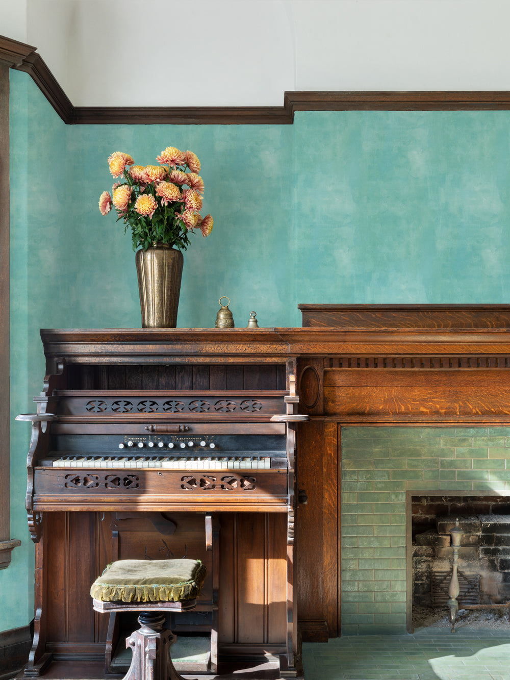 Aqua blue wallpaper on wall with subtle watercolor wash texture