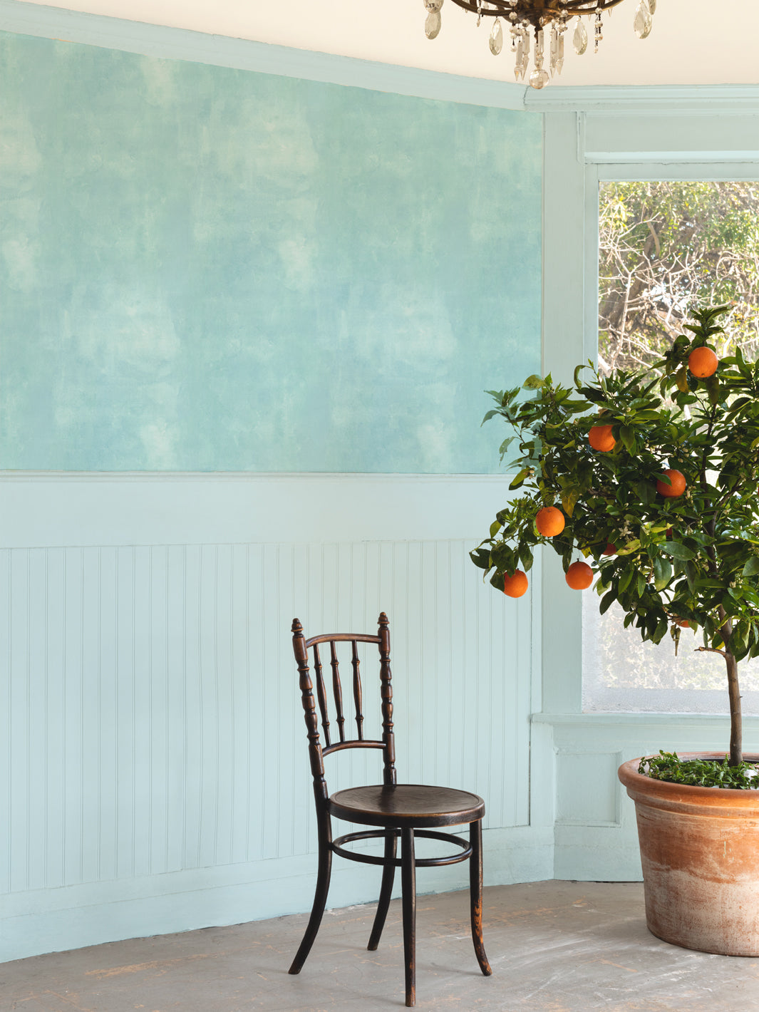 Blue watercolor textured wallpaper on wall with soft mottled finish