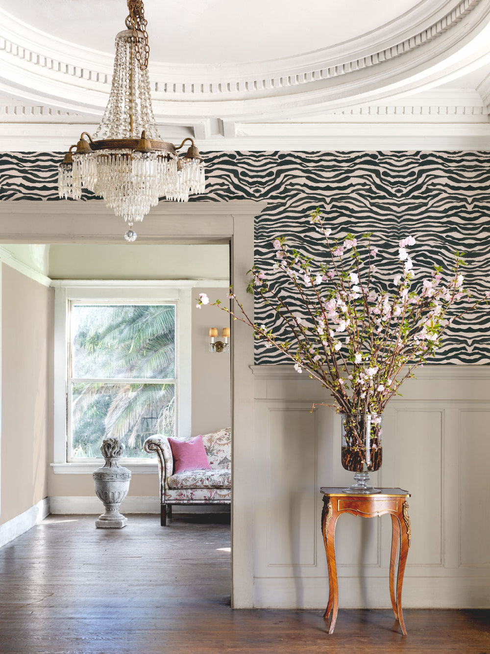Zebra print wallpaper in black and white wavy stripes on a wall