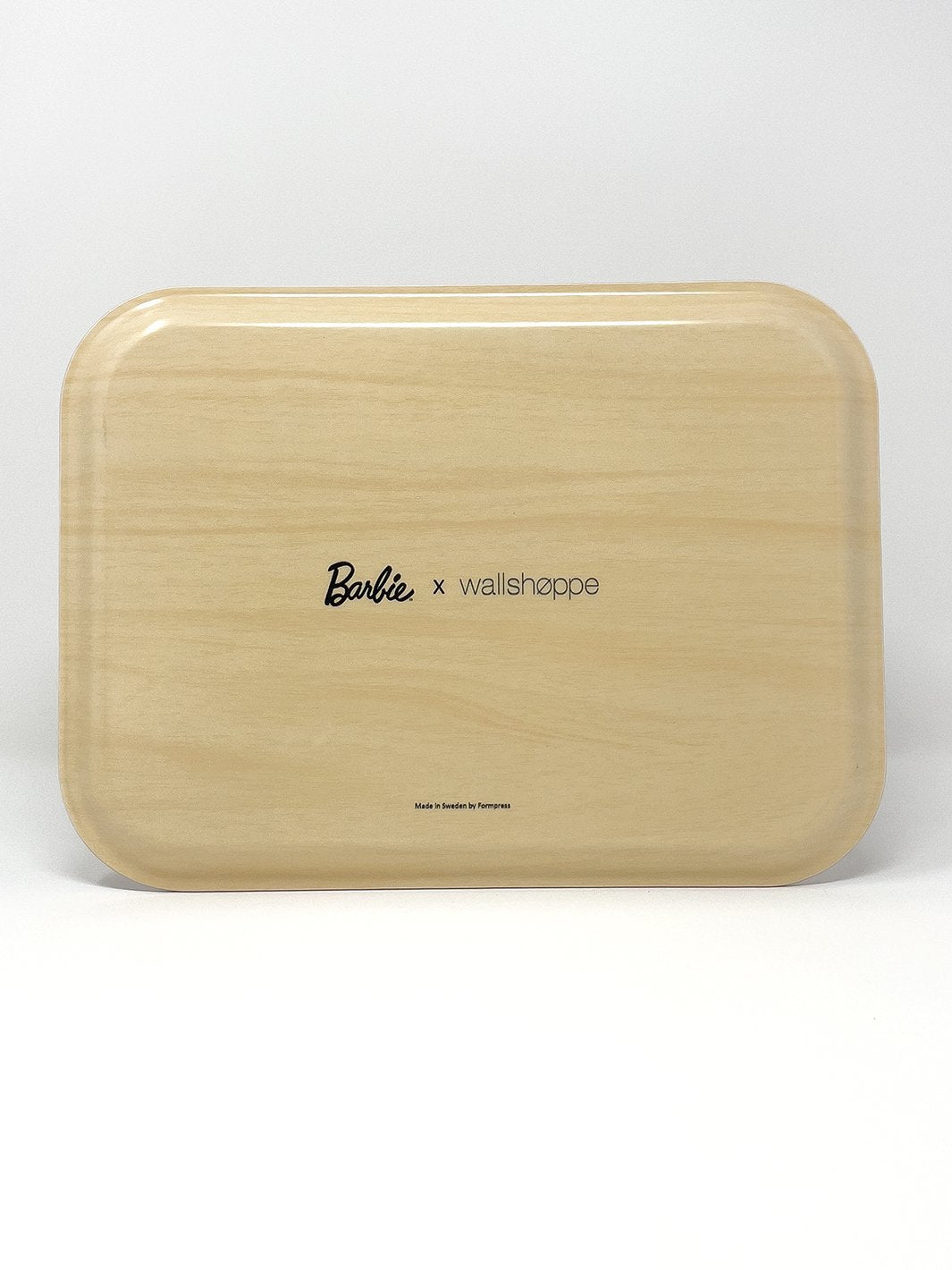 Cream tray underside with "Barbie x wallshoppe" logo text