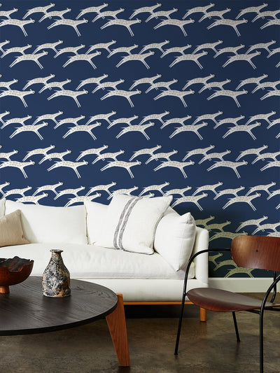 galloping giraffes wallpaper by tea collection navy