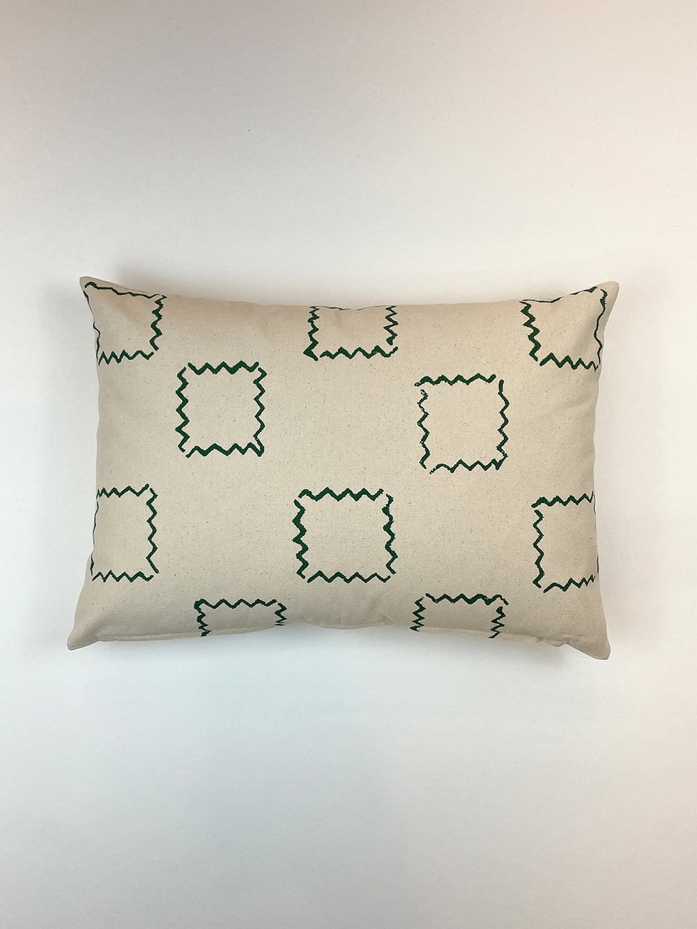 zag squares throw pillow green on raw canvas